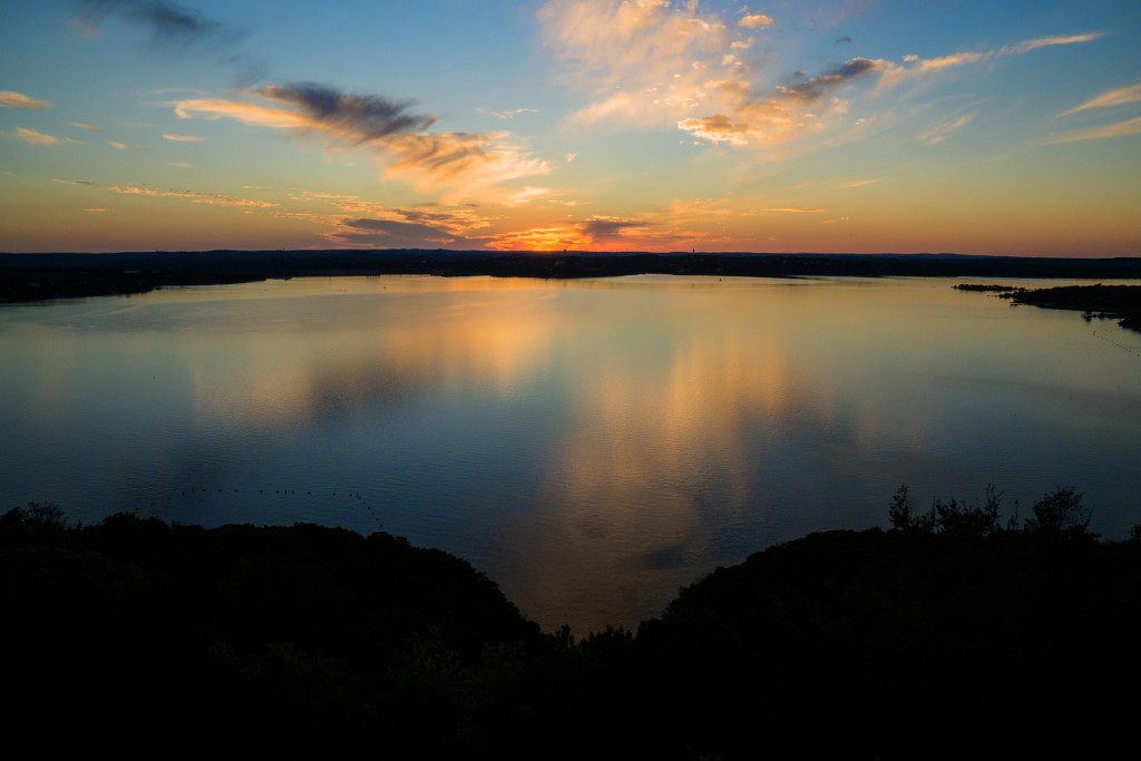 Enjoy a peaceful day of boating on nearby Lake Travis, followed by a spectacular sunset.